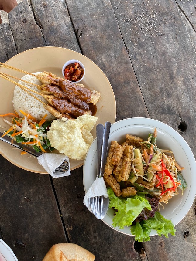 Satay - a typical Indonesian dish of protein covered in peanut sauce